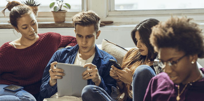 Group of friends hanging out in apartment