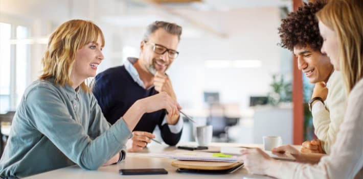 Group of four colleagues having a meeting