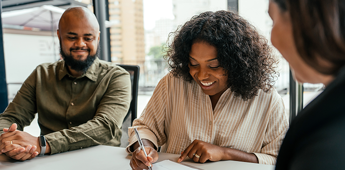 Leaders in a meeting work together.