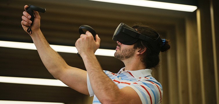 man-using-headset-in-jisc-office-square-new-generic