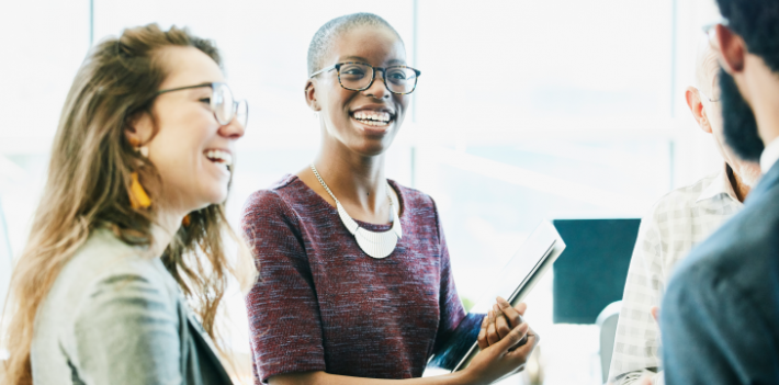 Two women smiling.