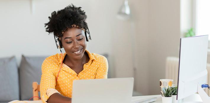 Adult learner studying on a laptop at home