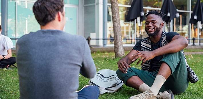Two friends chatting together.